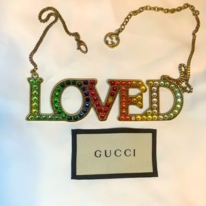 Gucci “loved” necklace.